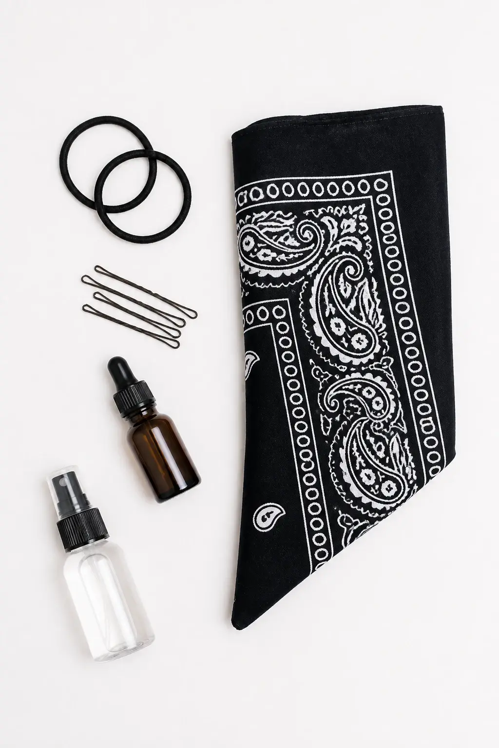Candid professional photograph of a REAL, living person (a real human model, never a mannequin, wig stand, display head, dummy, statue, doll or 3D render). Top-down flat-lay of a neatly arranged bandana styling kit: bandana, hair ties, bobby pins, smoothing serum, and a small spray bottle on a clean white surface; no people, focus on tools and fabric textures, soft window light, no text, no words, no letters, no watermark, no logo. full face and entire head fully inside the frame, clearly visible, sharp and in focus, never cropped or cut off at the edges, generous headroom, complete unobstructed face. a real, living, breathing human being &mdash; a genuine person modelling for a candid professional photograph &mdash; with natural lifelike skin, realistic warm skin texture, real pores, natural human expression and a real body. Absolutely NOT a mannequin, NOT a mannequin head, NOT a wig stand, NOT a wig display head, NOT a store dummy, NOT a display bust, NOT a statue, NOT a wax figure, NOT a doll, NOT a plastic figure, NOT a 3D render, NOT a hairstyle on a stand. fully clothed in tasteful modest everyday clothing, wholesome, family-friendly, safe for work, no nudity, no bare chest, no exposed skin beyond face and hands, non-sexual, appropriate