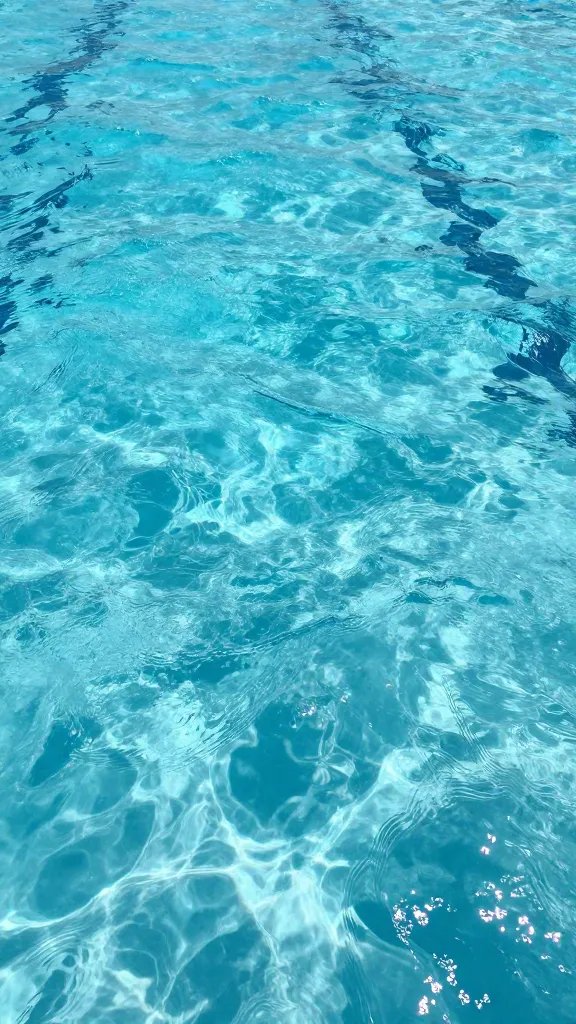 Clear water swimming area with gentle waves
