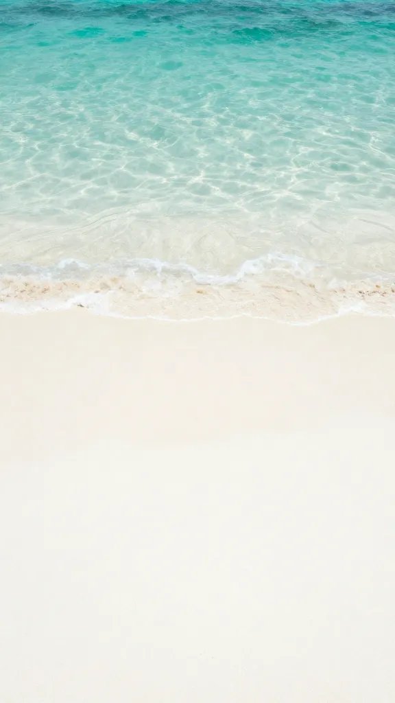 "soft white sand close-up with turquoise water"